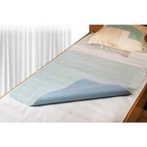 MultiMotion wasbare onderlegger (half omgevouwen op een matras)